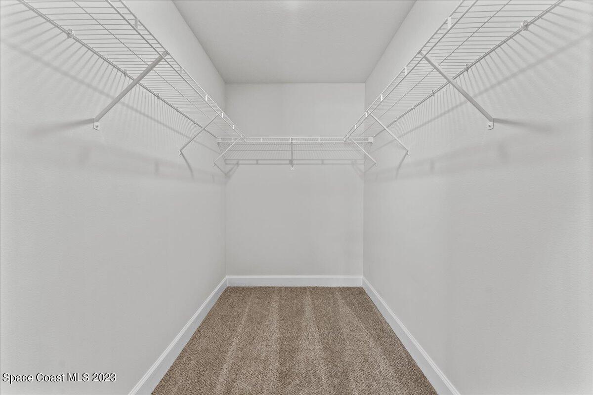 1341 Tupelo Circle Cocoa, FL 32926 - Photo 20 of 27 a view of a room with racks on the wall