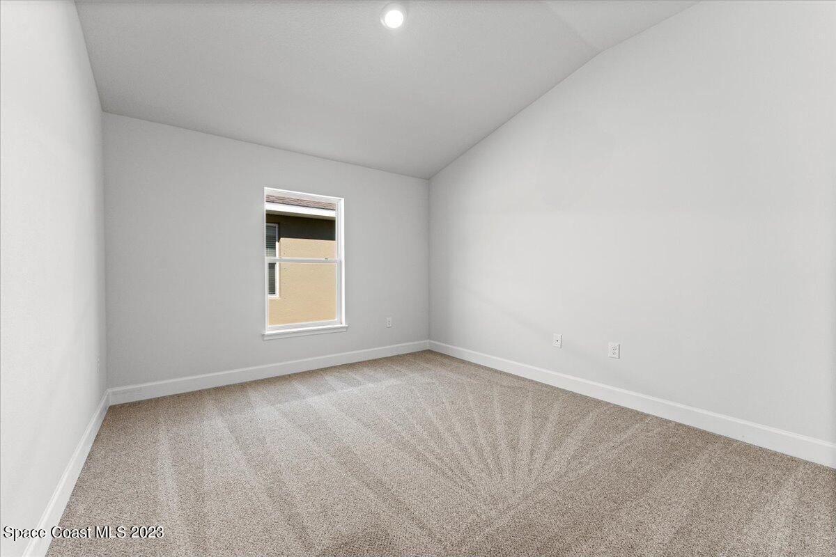 1341 Tupelo Circle Cocoa, FL 32926 - Photo 22 of 27 an empty room with a window