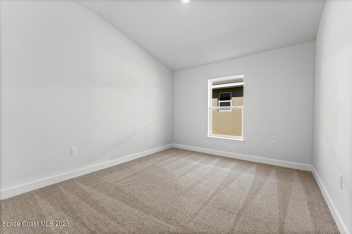 1341 Tupelo Circle Cocoa, FL 32926 - Photo 23 of 27 an empty room with a window