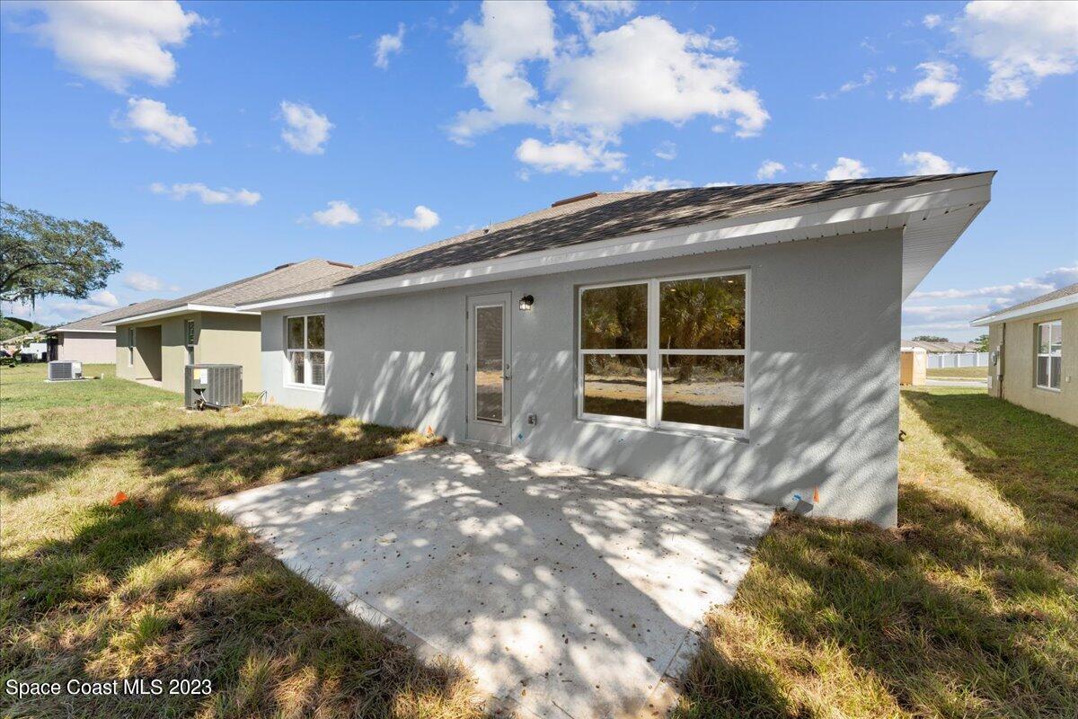 1341 Tupelo Circle Cocoa, FL 32926 - Photo 25 of 27 a view of a house with a patio