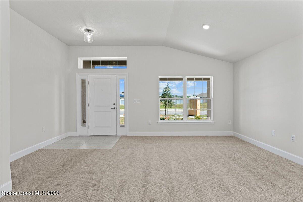 1341 Tupelo Circle Cocoa, FL 32926 - Photo 4 of 27 an empty room with windows
