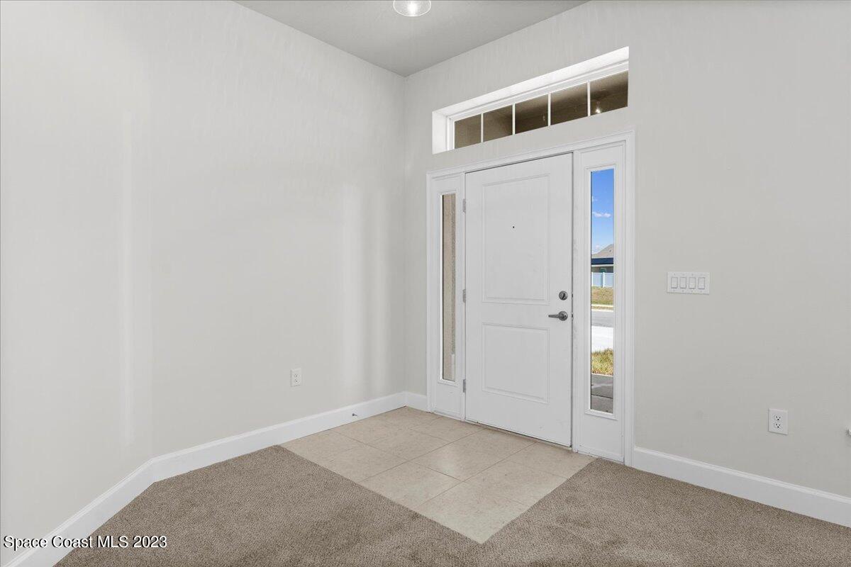 1341 Tupelo Circle Cocoa, FL 32926 - Photo 5 of 27 an empty room with windows