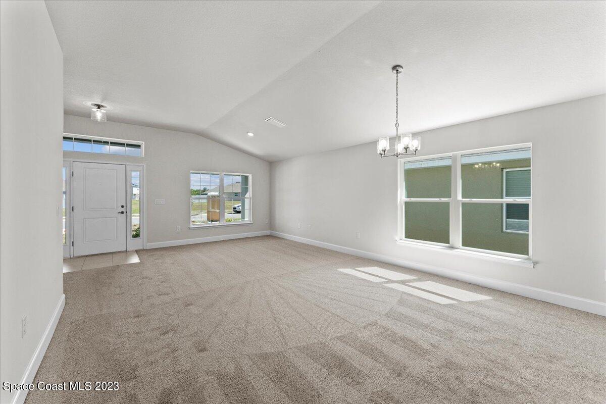 1341 Tupelo Circle Cocoa, FL 32926 - Photo 6 of 27 a view of an empty room with a window and fireplace