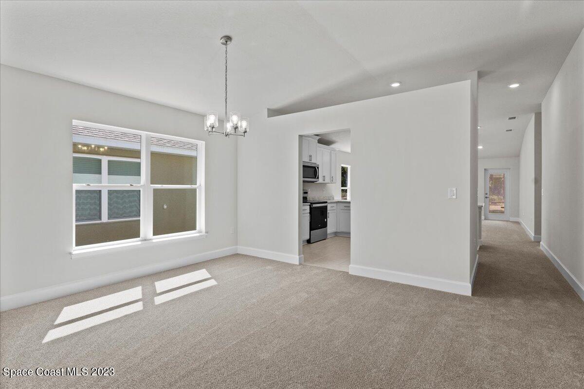 1341 Tupelo Circle Cocoa, FL 32926 - Photo 7 of 27 a view of an empty room with a window