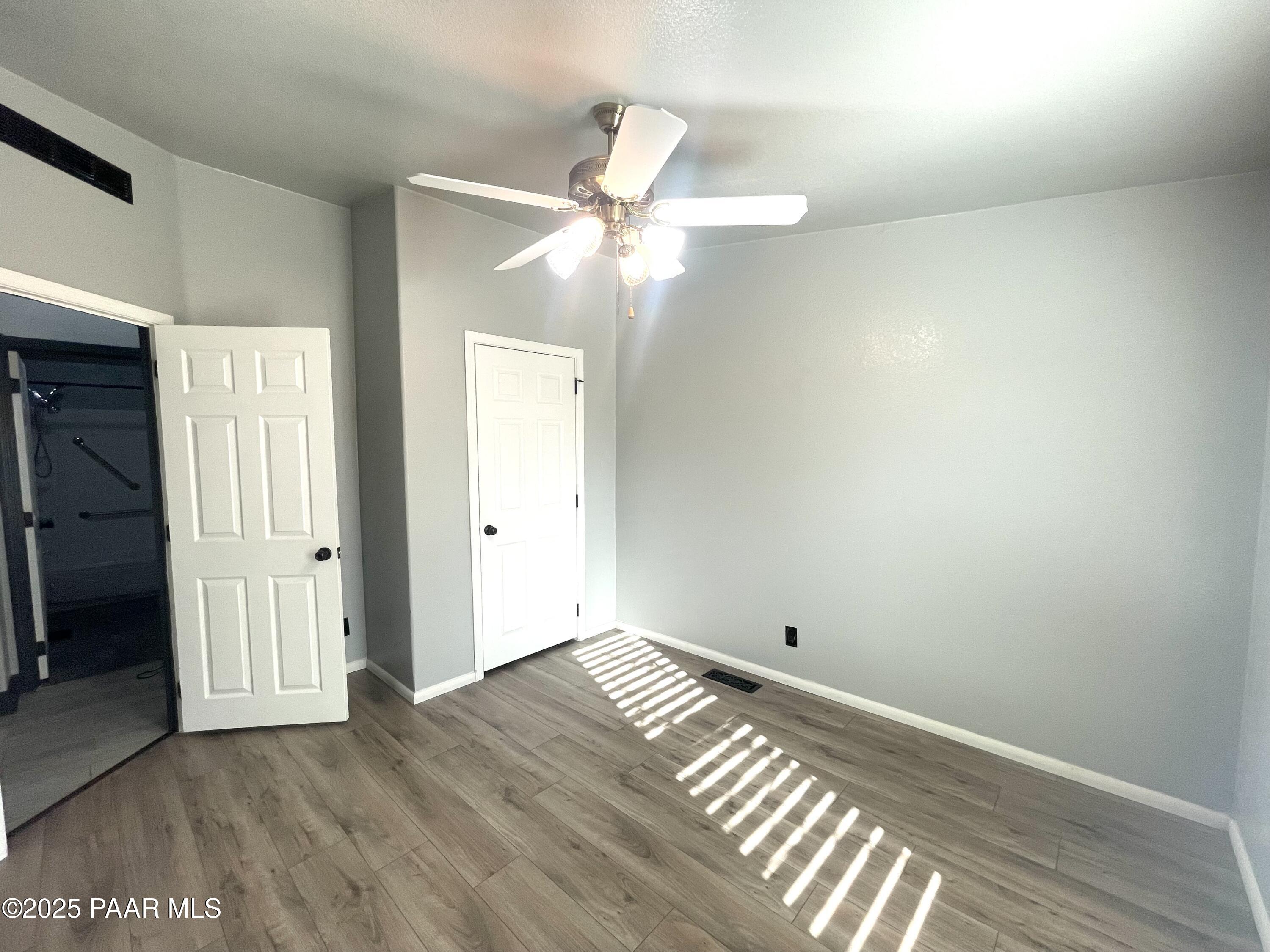 22355 North Docs Road Paulden, AZ 86334 - Photo 13 of 20 a view of empty room with wooden floor