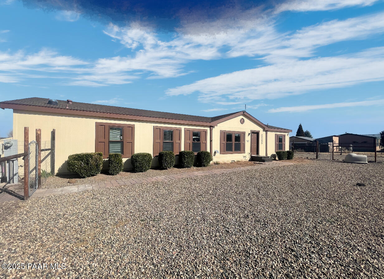 22355 North Docs Road Paulden, AZ 86334 - Photo 2 of 20 a view of a house with backyard of roof and wooden fence