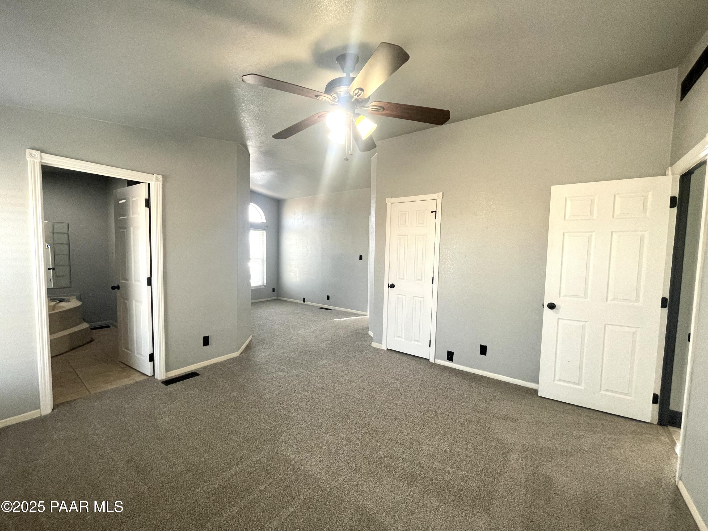 22355 North Docs Road Paulden, AZ 86334 - Photo 7 of 20 a view of an empty room with a ceiling fan