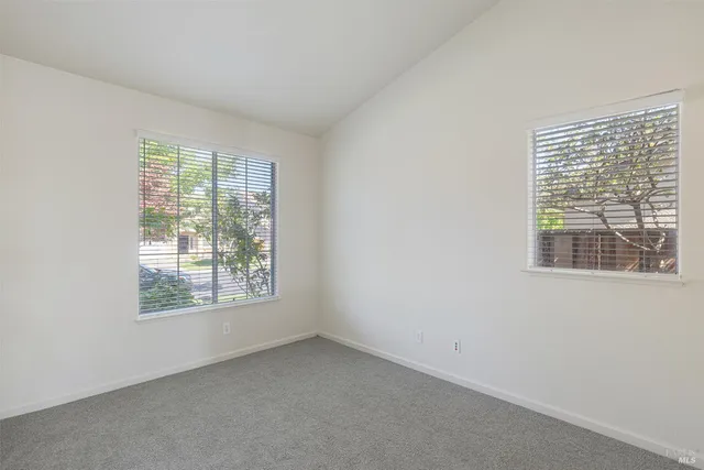 a view of an empty room with a fireplace