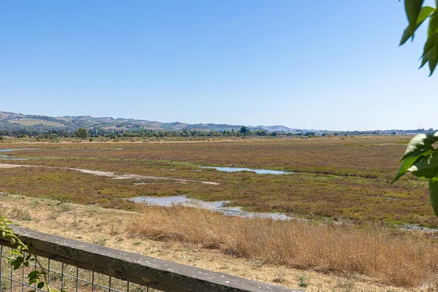 a front view of a house with a garden and porch