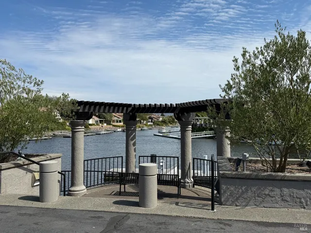 an aerial view of residential house and sandy dunes