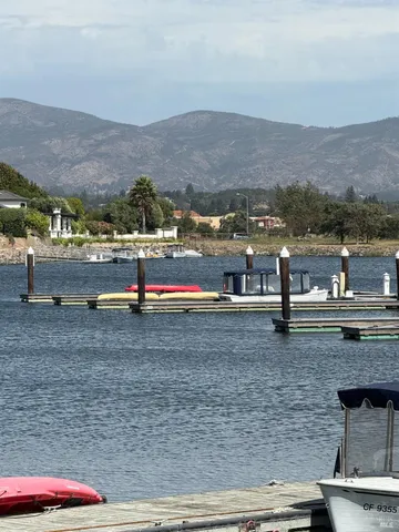 a kitchen with a table chairs and white cabinets