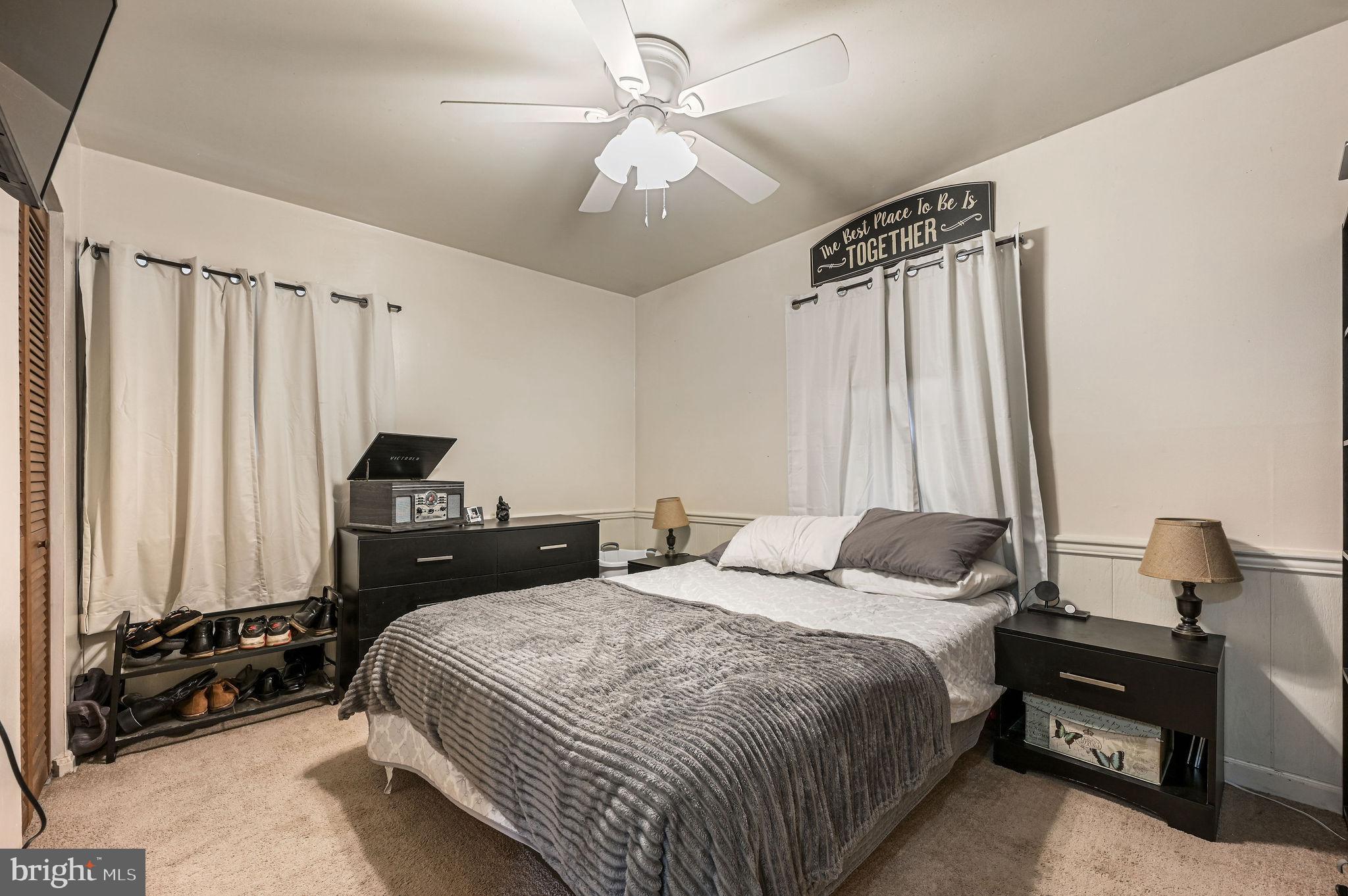 87 Wayne Drive Dover, DE 19901 - Photo 12 of 20 a bedroom with a bed and a chandelier