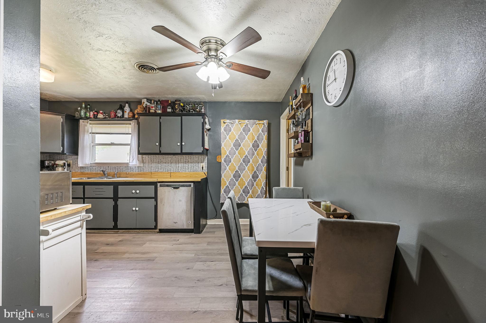 87 Wayne Drive Dover, DE 19901 - Photo 17 of 20 a kitchen with cabinets table and chairs