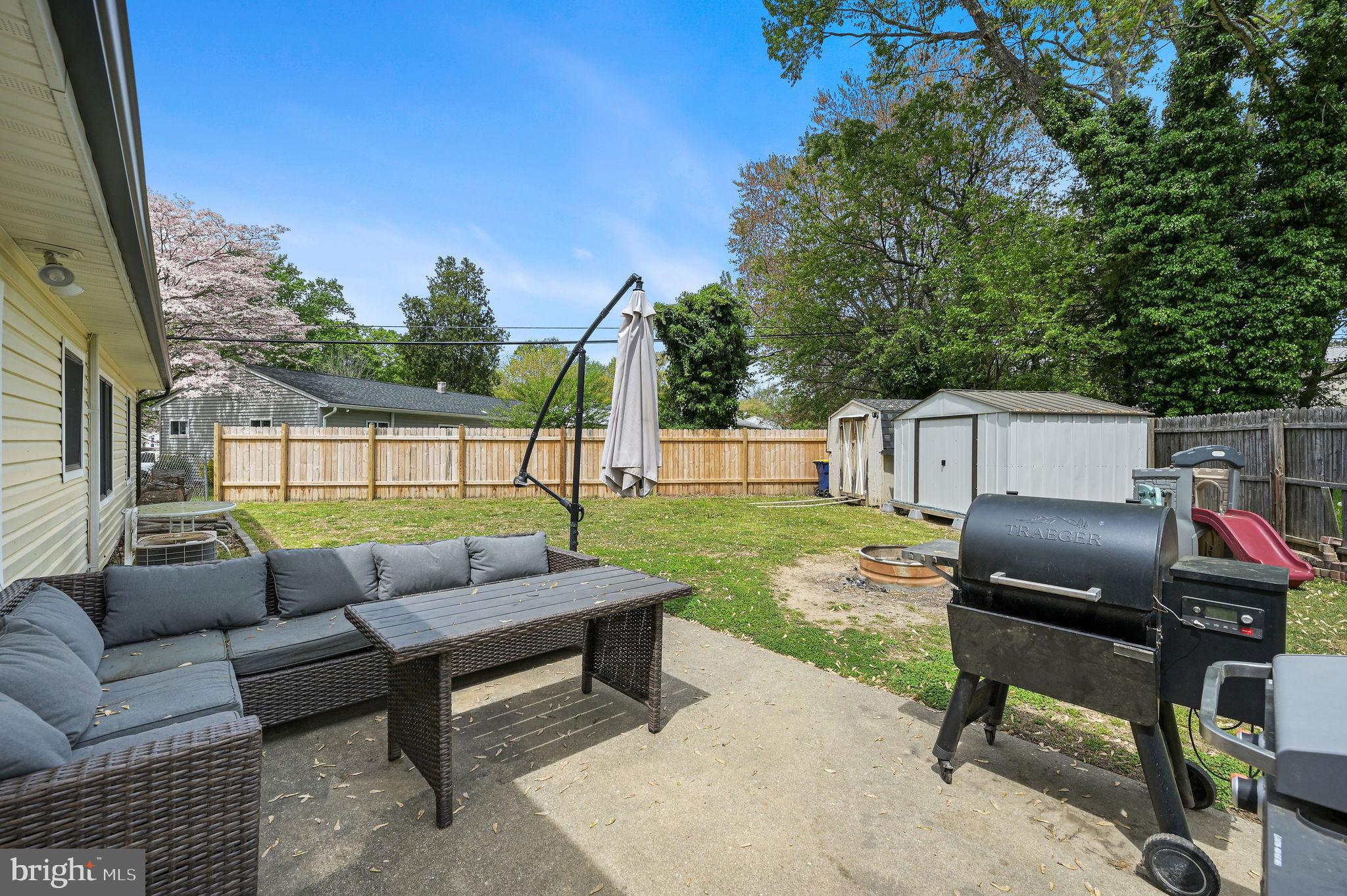 87 Wayne Drive Dover, DE 19901 - Photo 3 of 20 a view of a yard with a furniture in a backyard