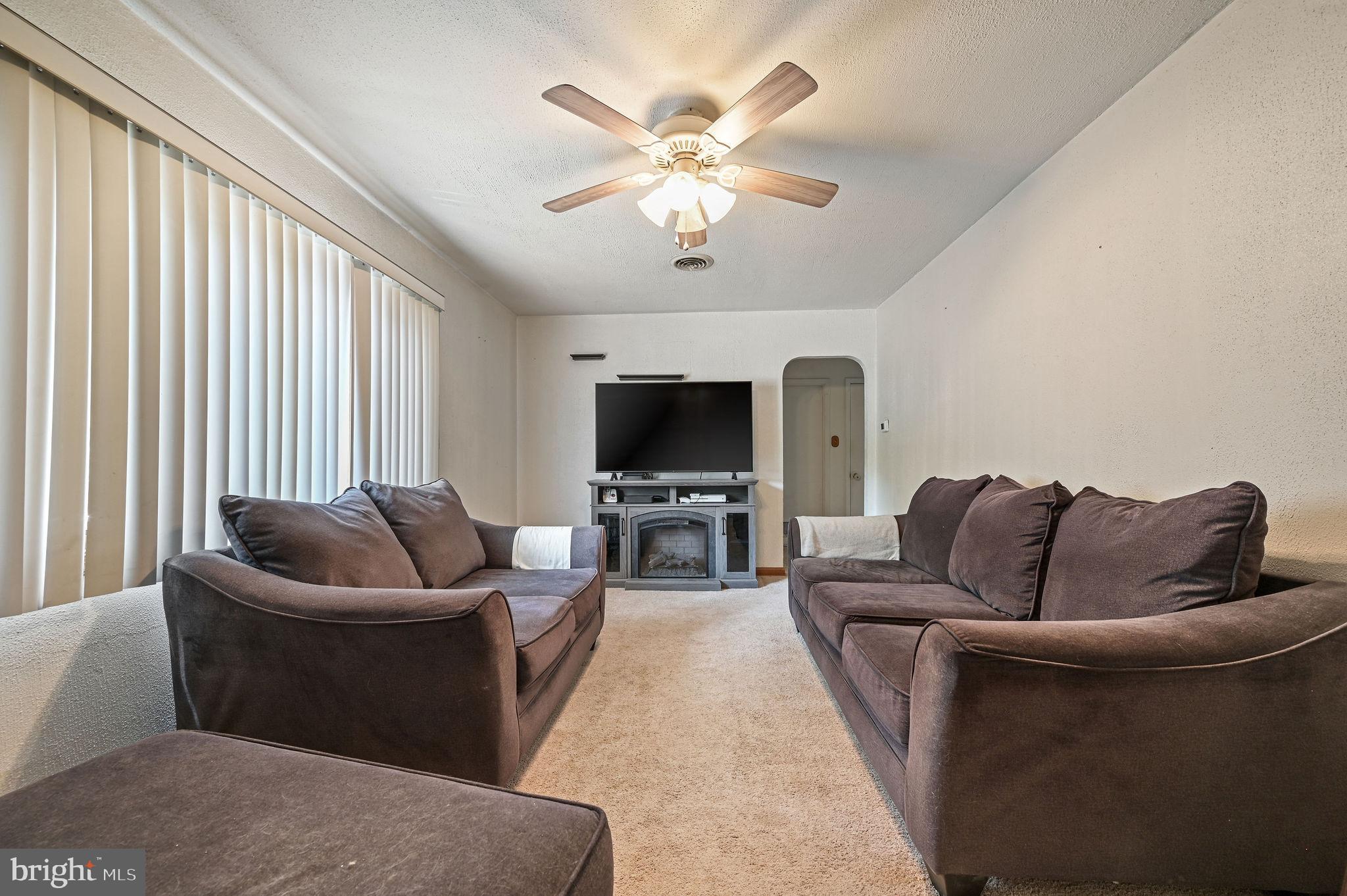 87 Wayne Drive Dover, DE 19901 - Photo 7 of 20 a living room with furniture and a flat screen tv