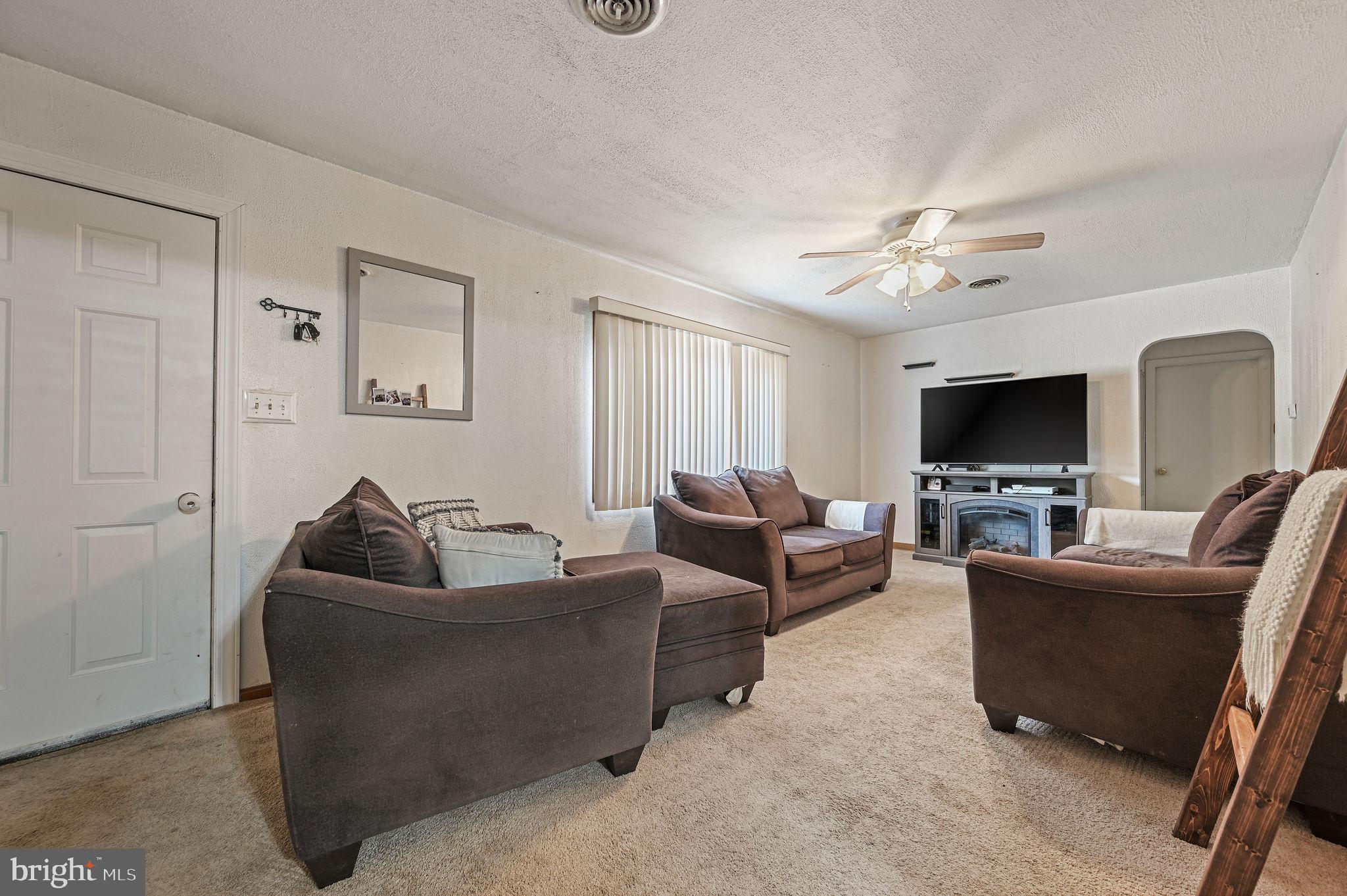 87 Wayne Drive Dover, DE 19901 - Photo 8 of 20 a living room with furniture and a flat screen tv