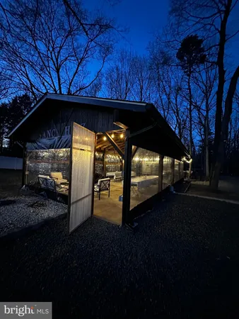 a view of a backyard with sitting area