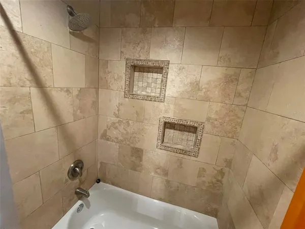 a bathroom with a sink and shower
