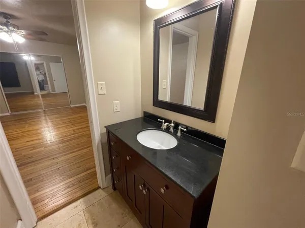 a bathroom with a sink and a mirror