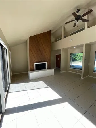 a view of an empty room and fire place