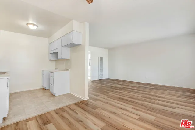 a view of a kitchen with wooden floor