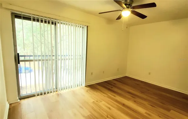 a view of an empty room with a window