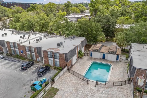 an aerial view of a house with a lake view