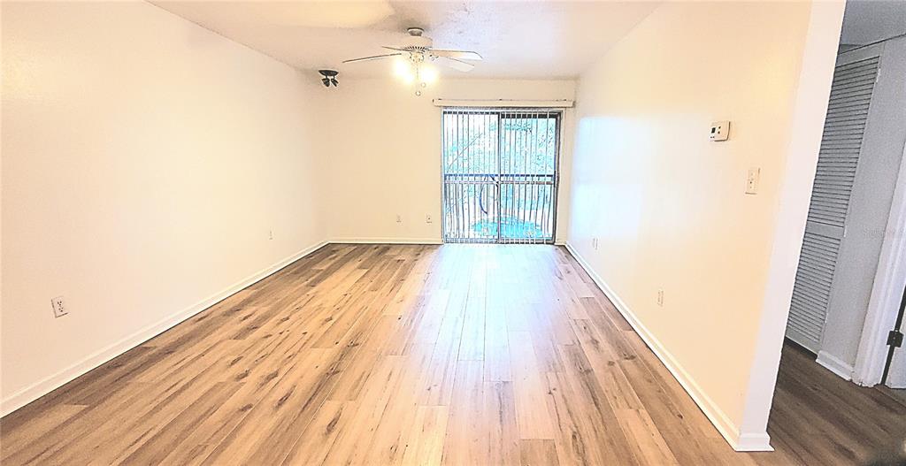 1700 Southwest 16th Court, Unit E29 Gainesville, FL 32608 - Photo 3 of 15 a view of wooden floor in a room
