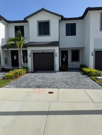 a front view of a house with yard