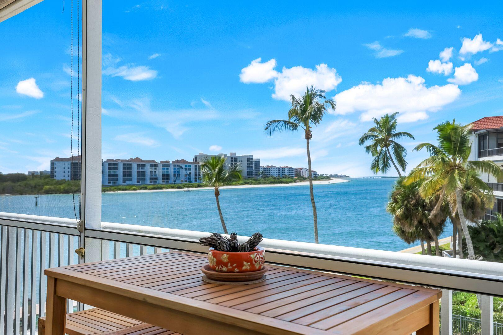 60 West Pelican Street, Unit 407 Naples, FL 34113 - Photo 2 of 26 a view of a balcony with a potted plants