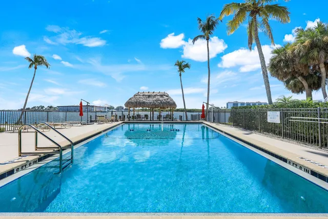 a view of a swimming pool with a lounge chairs