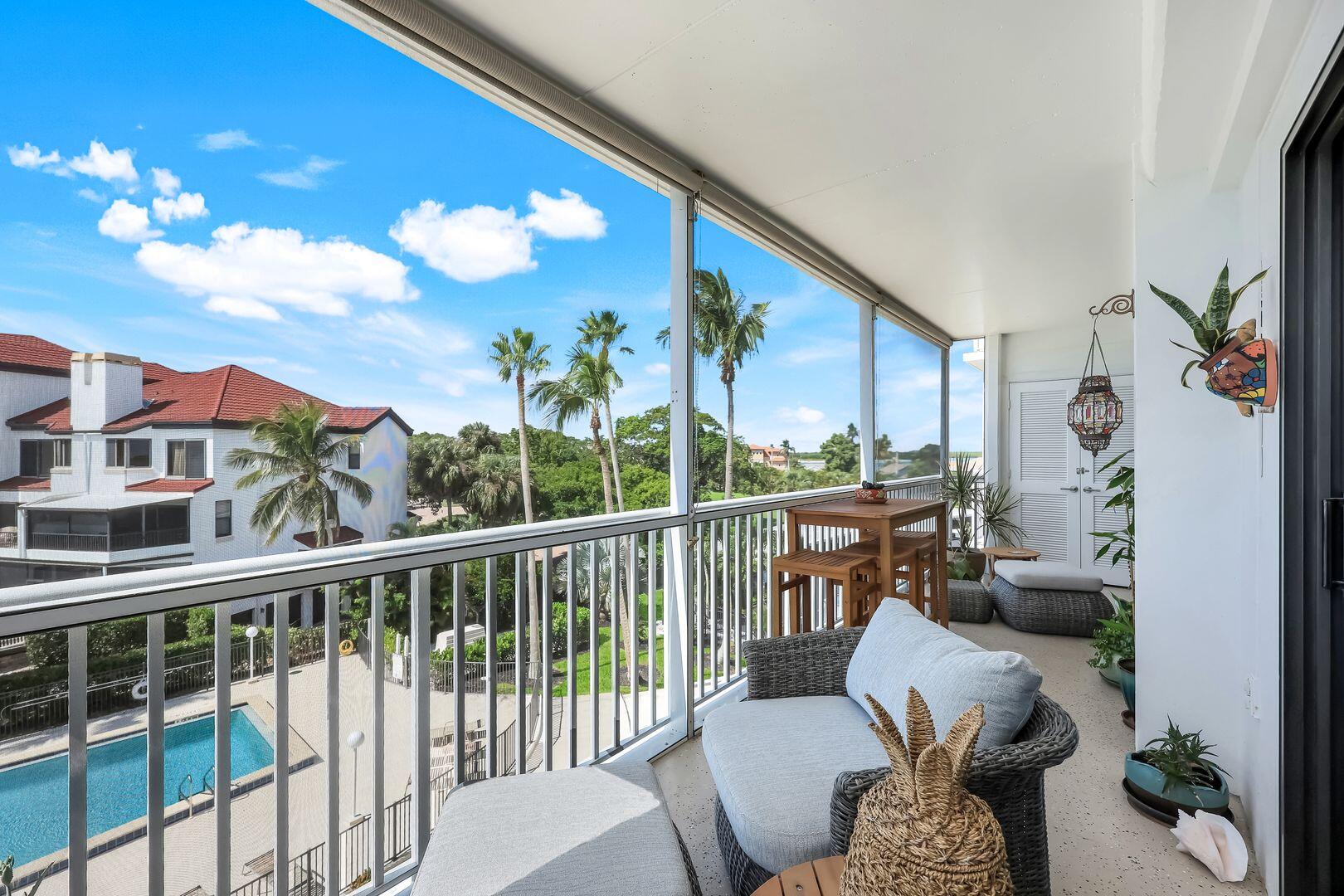 60 West Pelican Street, Unit 407 Naples, FL 34113 - Photo 3 of 26 a view of a balcony with furniture
