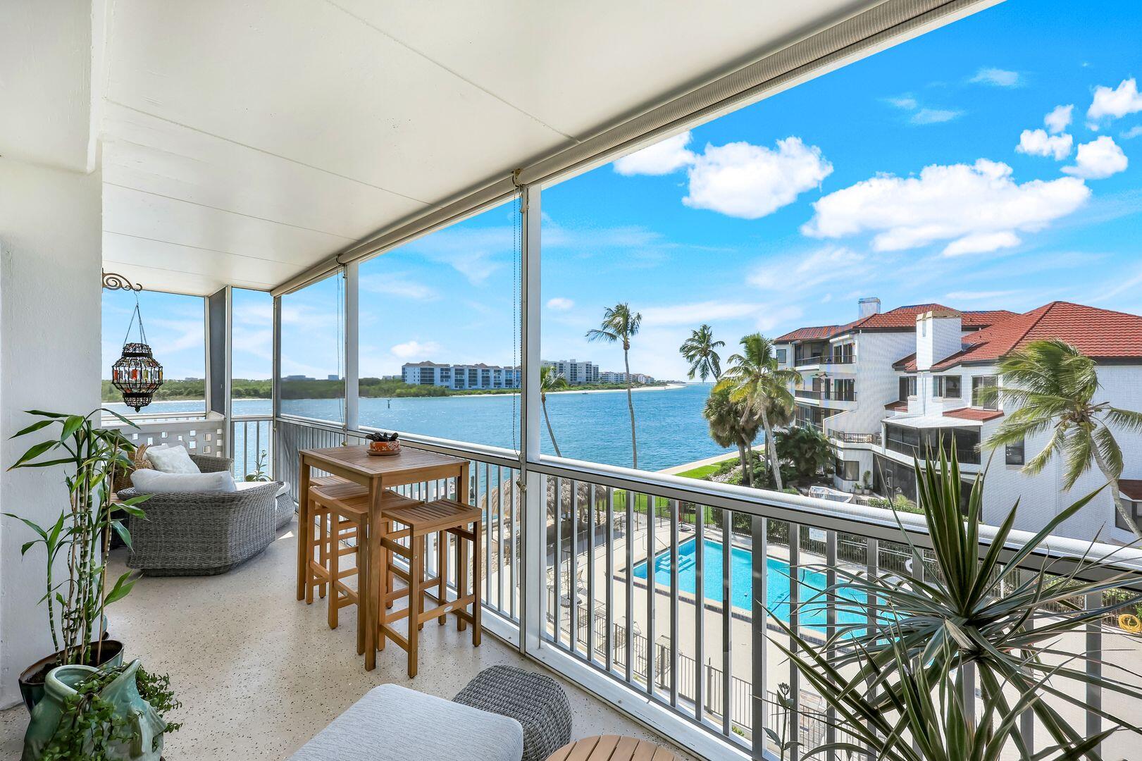 60 West Pelican Street, Unit 407 Naples, FL 34113 - Photo 4 of 26 a view of a balcony with furniture