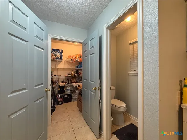 a kitchen with a sink stove and refrigerator