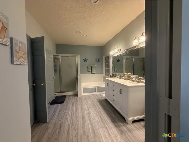 a bathroom with a sink and mirror