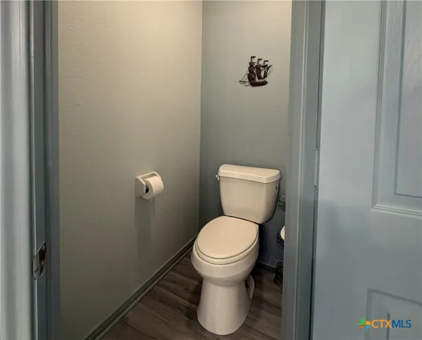 a view of a dining room with furniture wooden floor and a rug