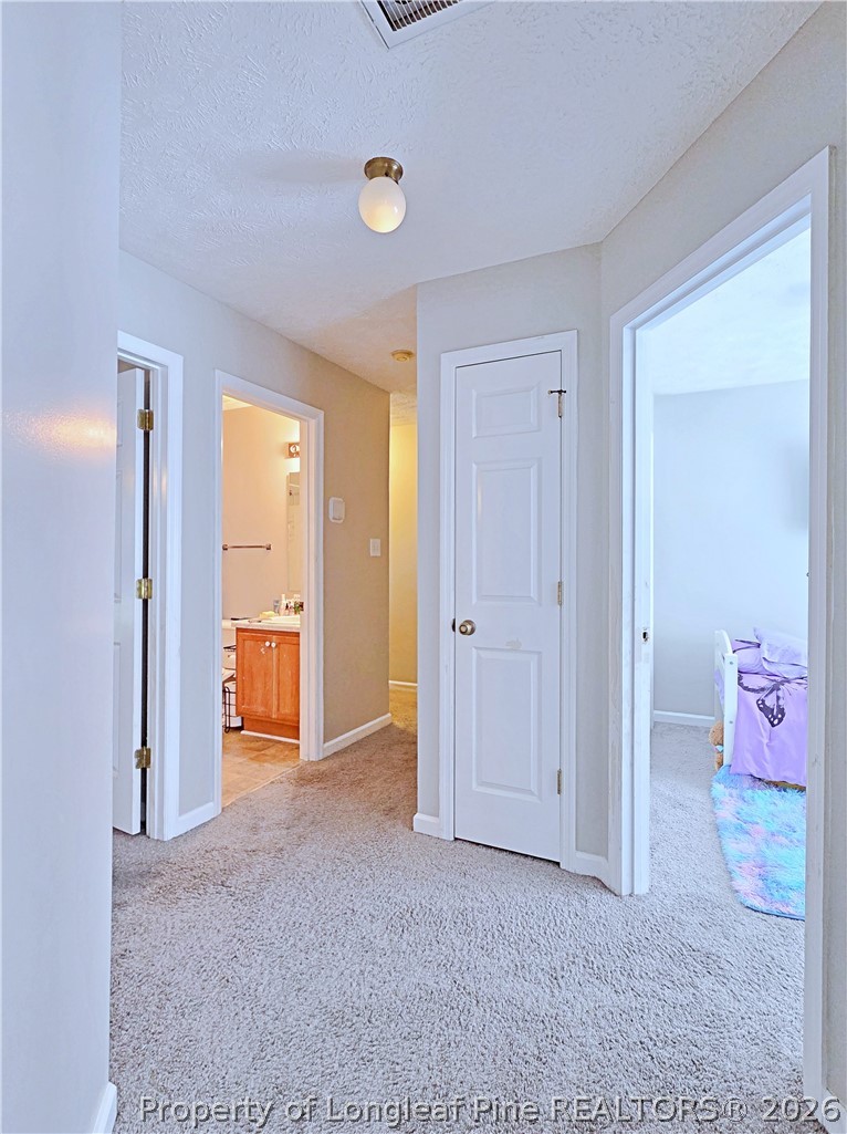 5218 Pringle Way Hope Mills, NC 28348 - Photo 20 of 43 wooden floor and closet area in a room