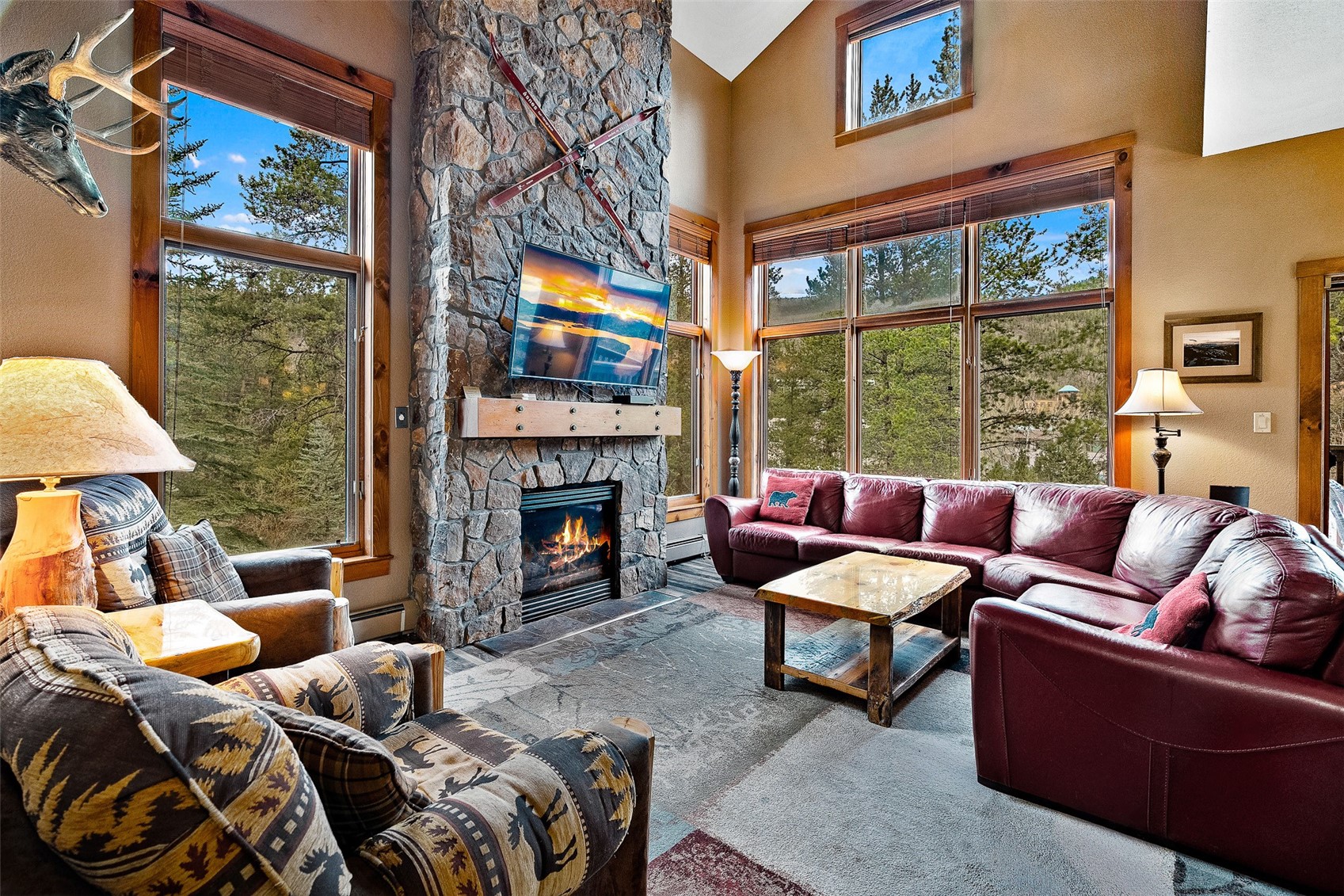 57 Lake Ridge Circle, Unit 1848 Keystone, CO 80435 - Photo 2 of 49 a living room with furniture a fireplace and a flat screen tv