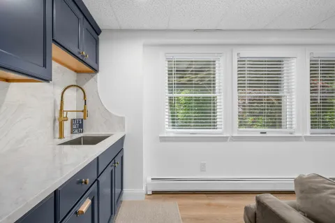 a bathroom with a sink and a window