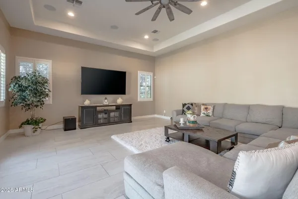 a room with lots of books and a window