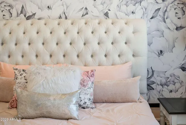 a spacious bathroom with a tub sink and mirror