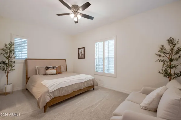 a bedroom with bed and window