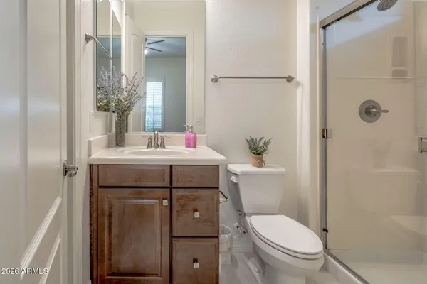a bathroom with a sink toilet and mirror