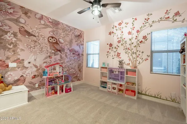 a living room with furniture a couch and a potted plant