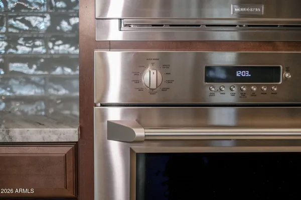 a kitchen with a refrigerator and a sink