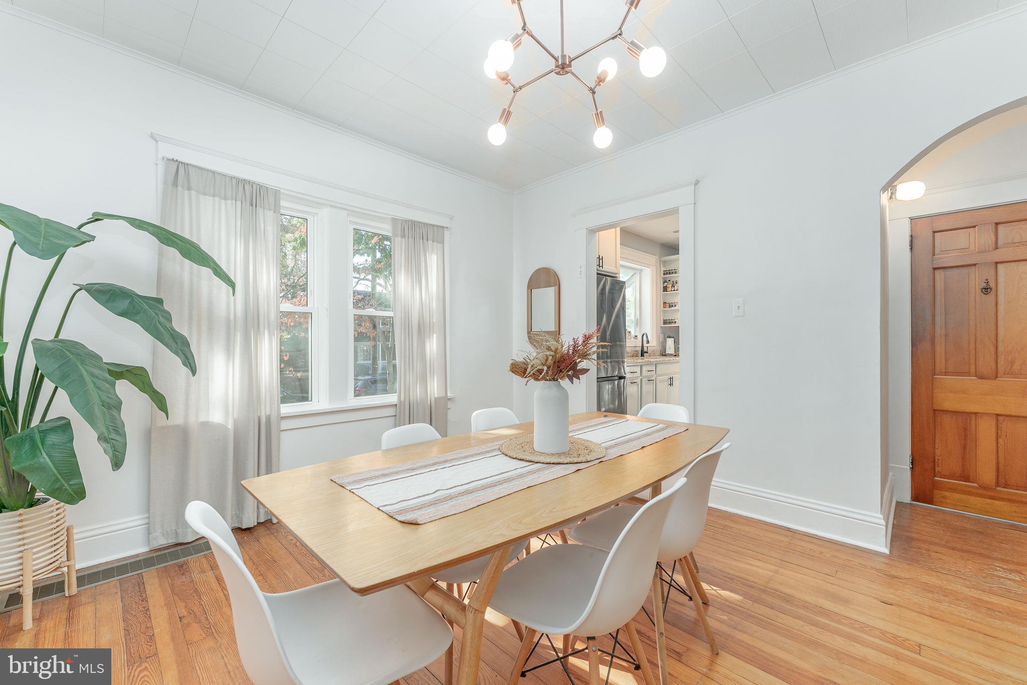 864 North Avenue Springfield, PA 19064 - Photo 15 of 33 a view of a dining room with furniture window and wooden floor