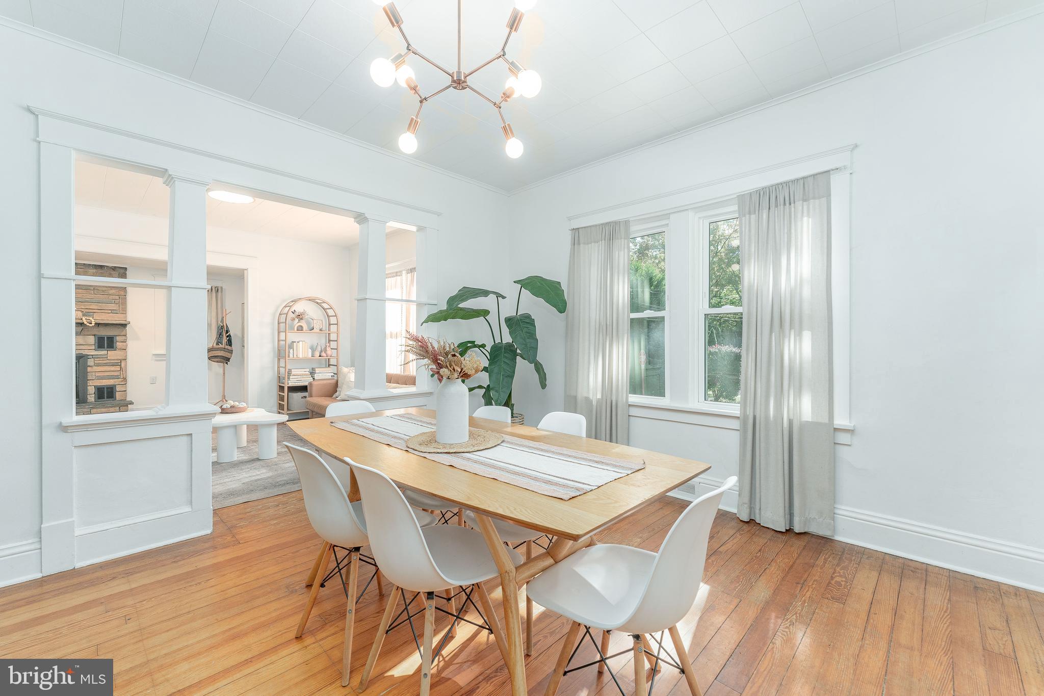 864 North Avenue Springfield, PA 19064 - Photo 16 of 33 a view of a dining room with furniture wooden floor and chandelier
