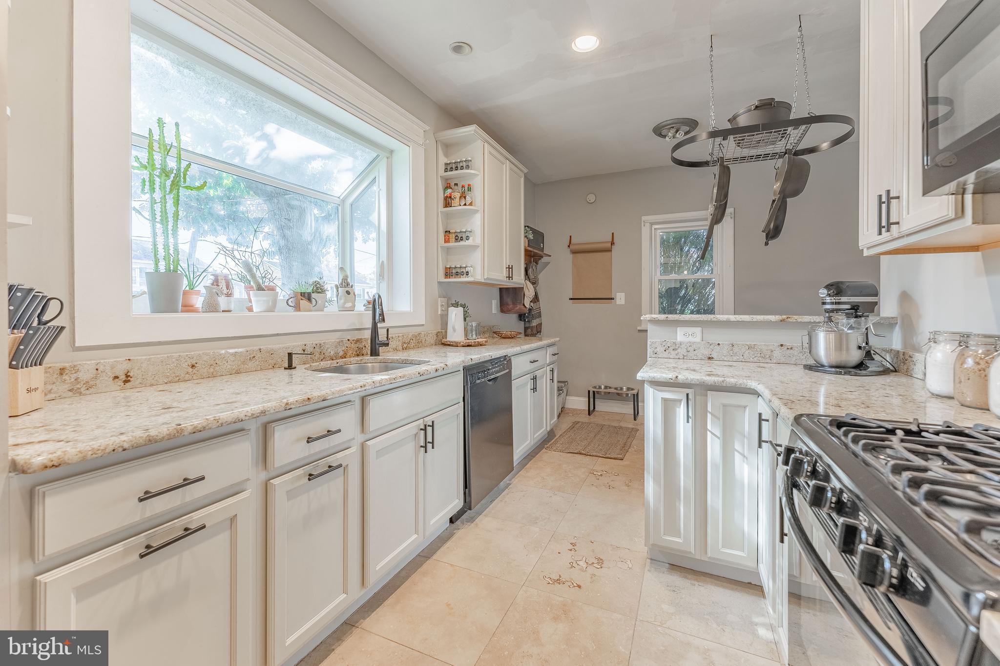 864 North Avenue Springfield, PA 19064 - Photo 18 of 33 a kitchen with sink stove and cabinets