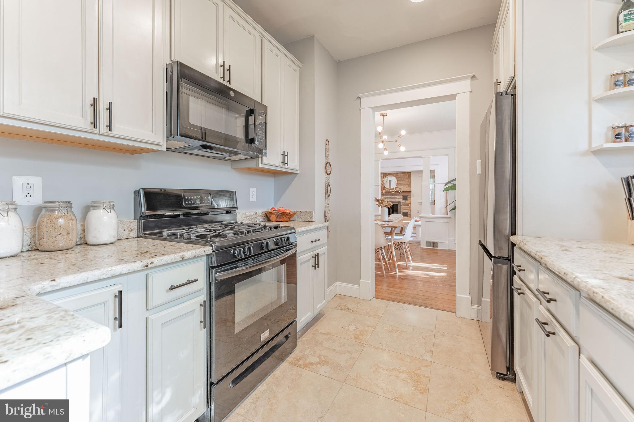 864 North Avenue Springfield, PA 19064 - Photo 22 of 33 a kitchen with stainless steel appliances granite countertop a refrigerator and a stove top oven