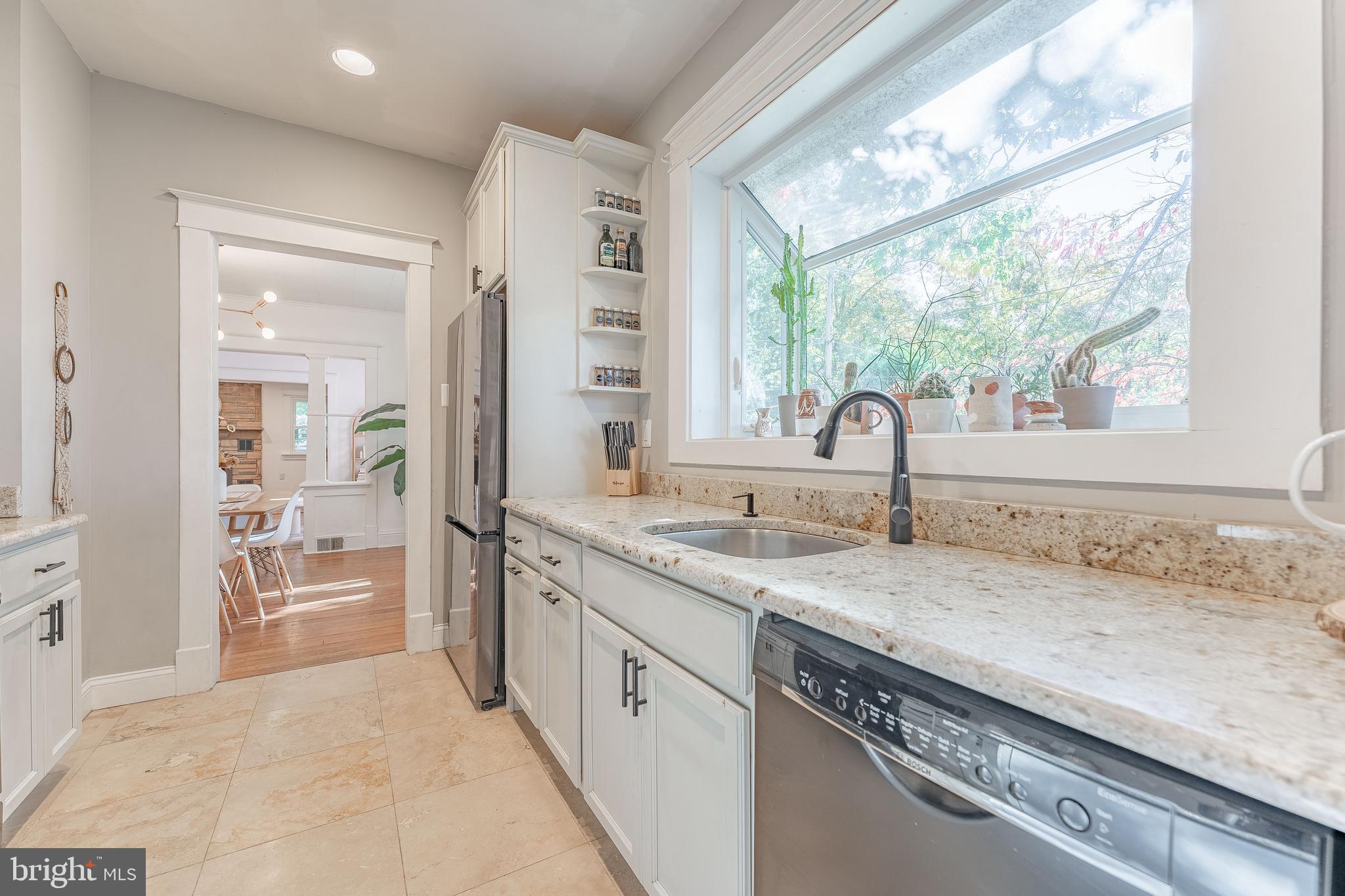 864 North Avenue Springfield, PA 19064 - Photo 23 of 33 a kitchen with granite countertop a sink and a window